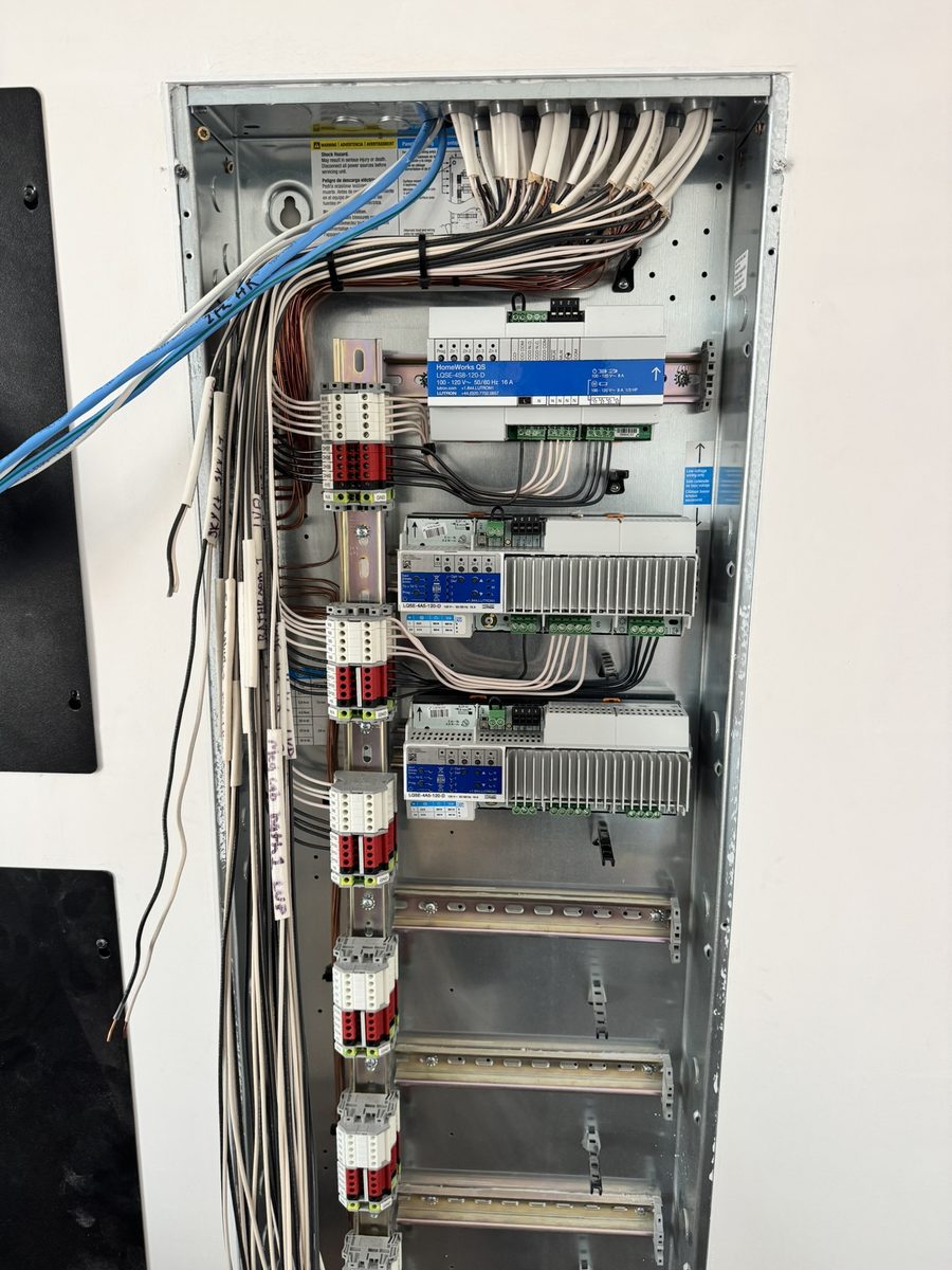 Lutron HomeWorks QS lighting control panel wired and labeled